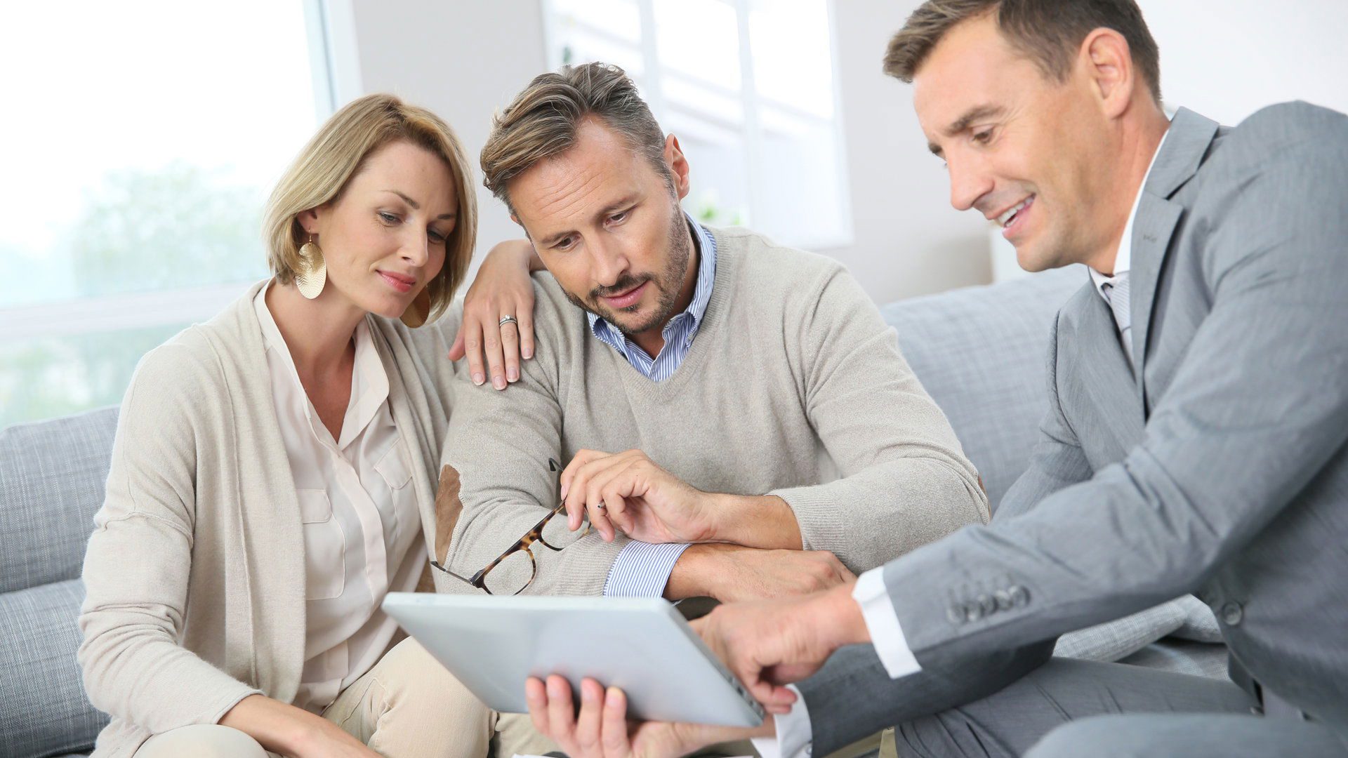 Financial adviser showing terms of contract on tablet